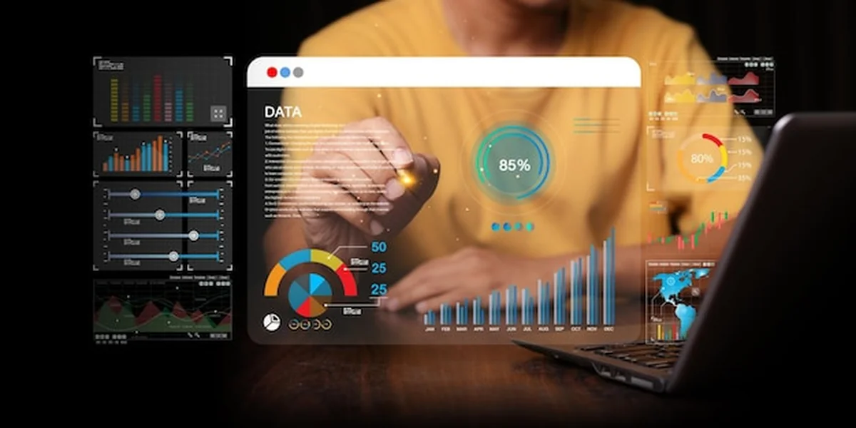 Analityk danych na desce rozdzielczej z wykresami KPI i metrykami podłączonymi do bazy danych